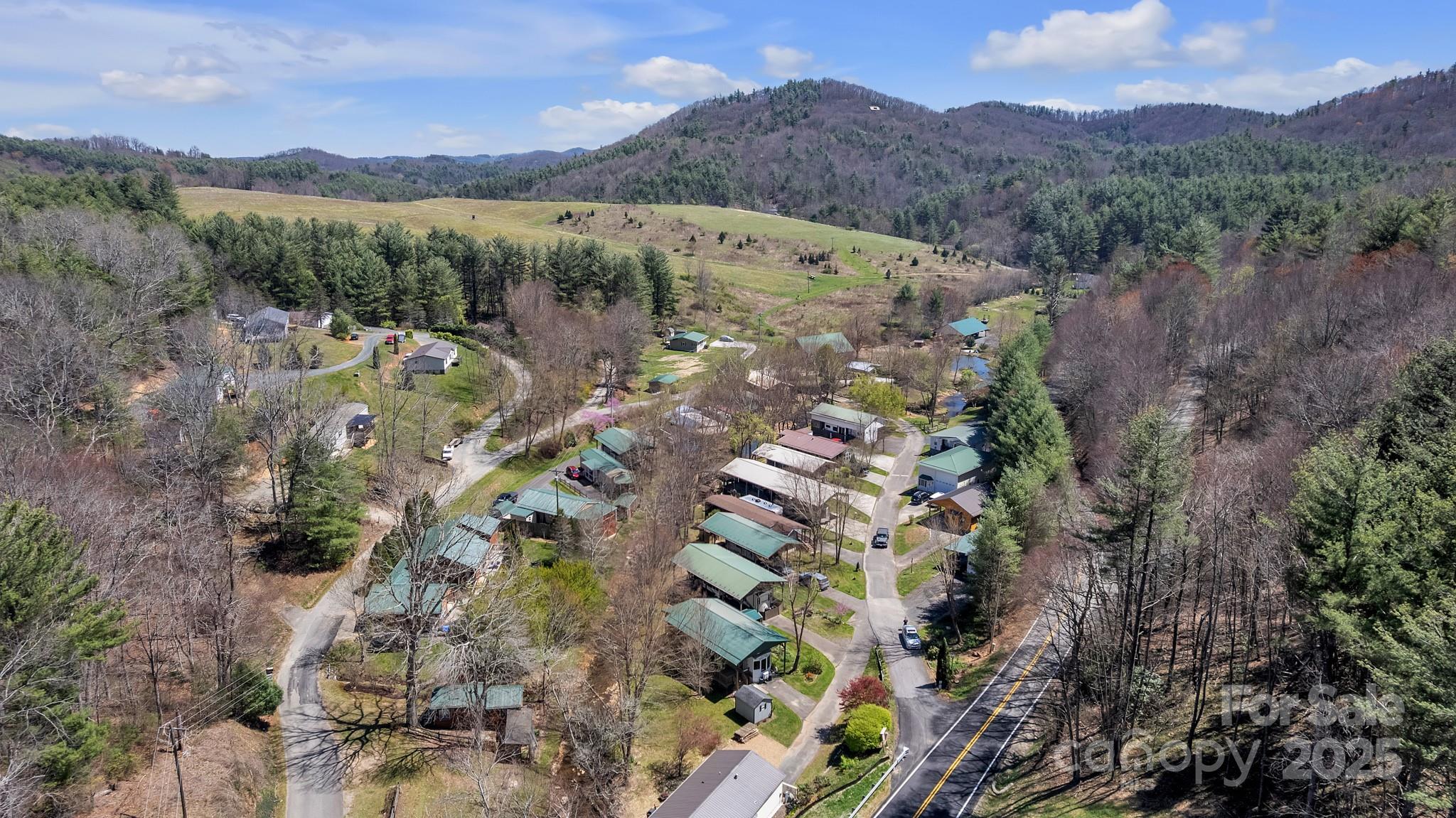 195 Finch Way, Unit 7 West Jefferson, NC 28694 - Photo 2 of 39 a view of a city with mountain
