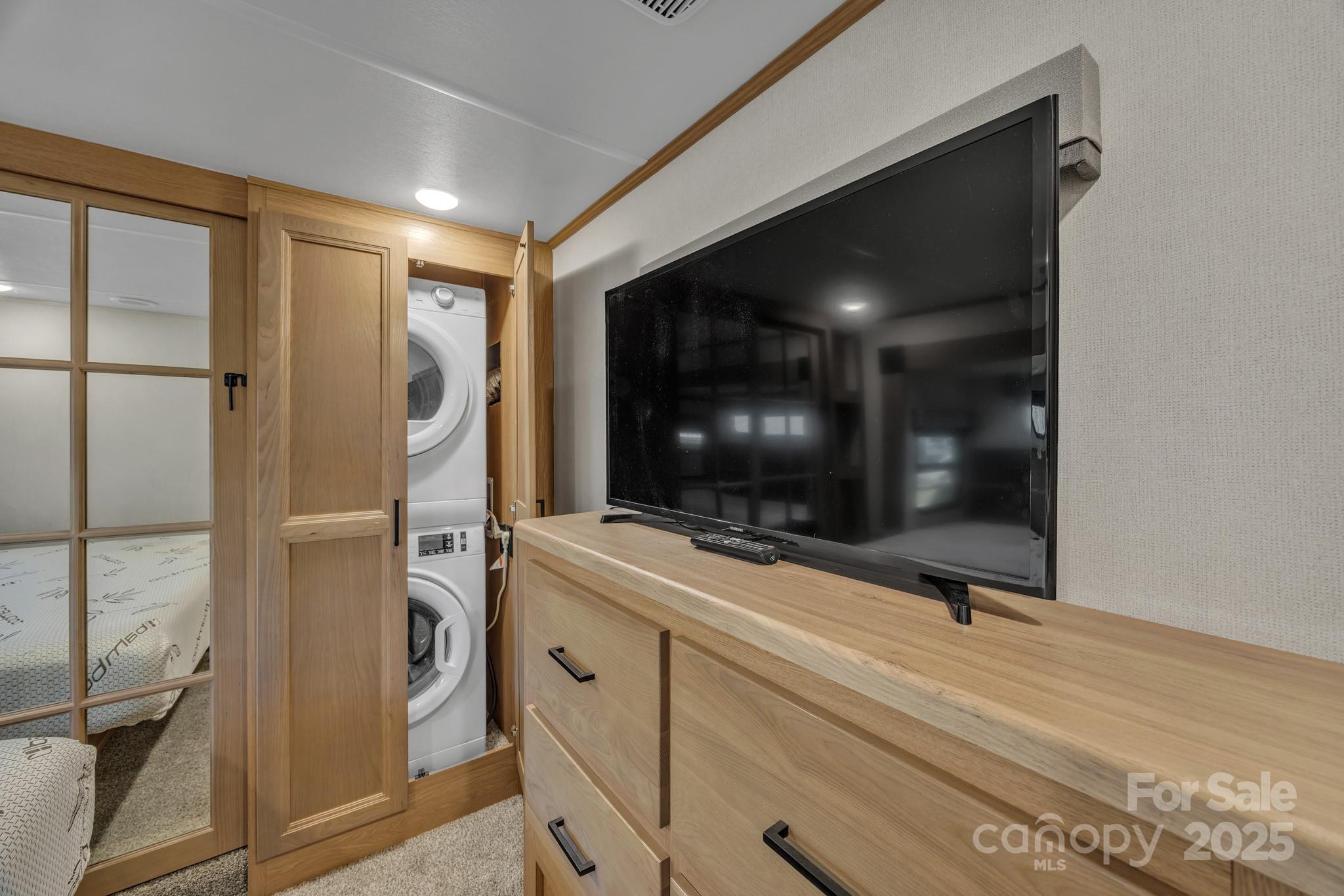 195 Finch Way, Unit 7 West Jefferson, NC 28694 - Photo 26 of 39 a living room with a flat screen tv and a floor to ceiling window
