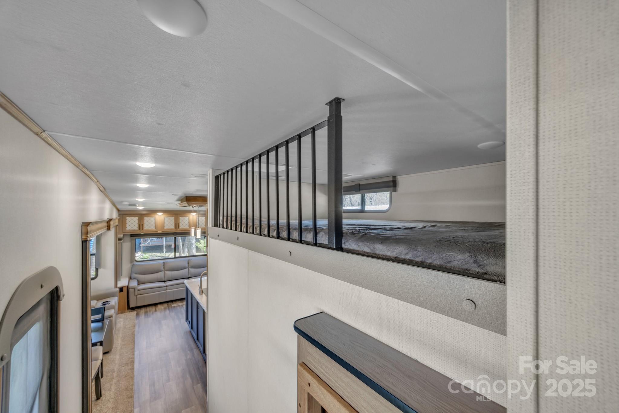 195 Finch Way, Unit 7 West Jefferson, NC 28694 - Photo 29 of 39 a view of a hallway with wooden floor and entryway