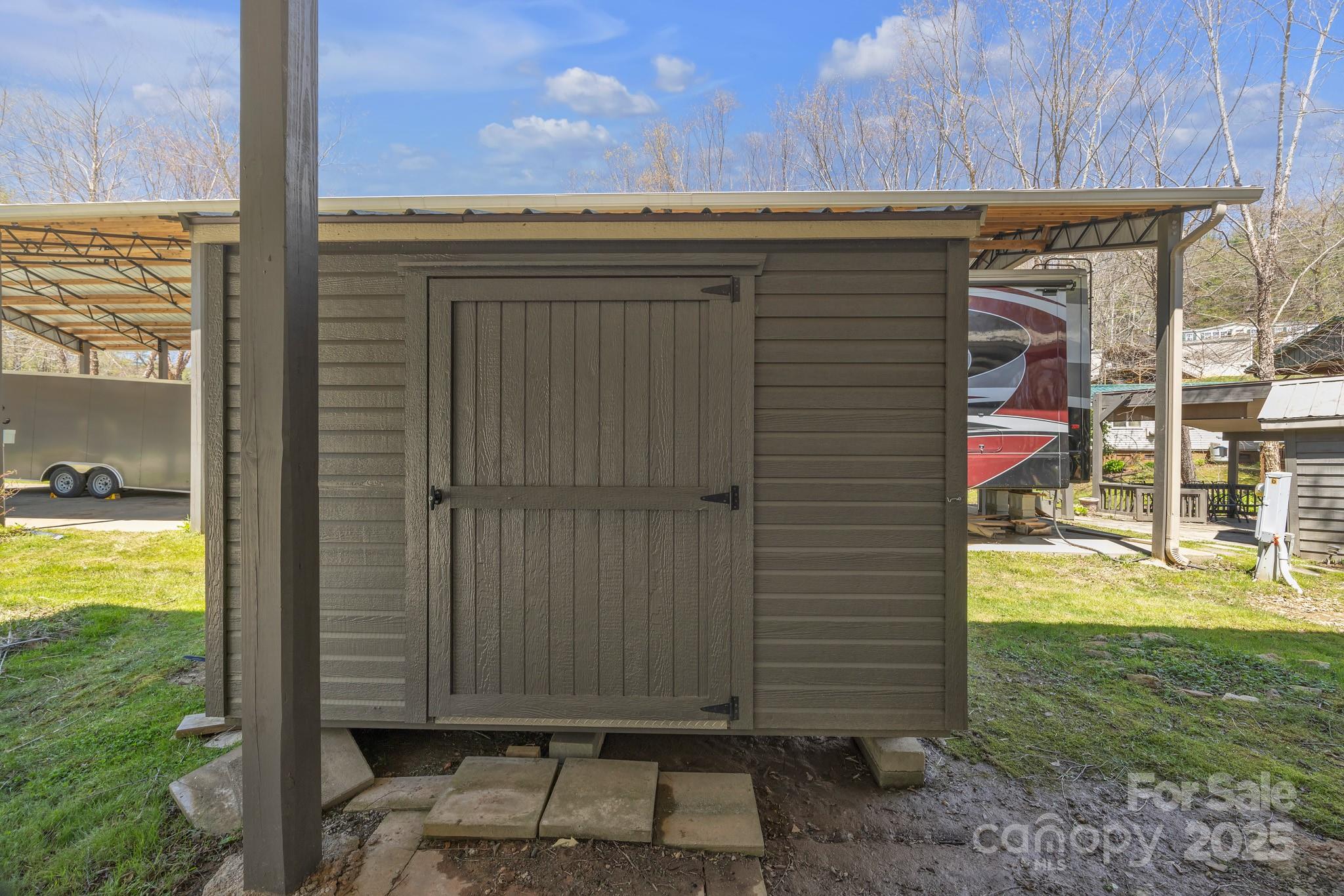 195 Finch Way, Unit 7 West Jefferson, NC 28694 - Photo 34 of 39 a view of a house with a backyard