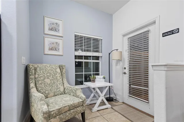 a living room with furniture and a window