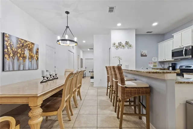 a dining room with furniture and window