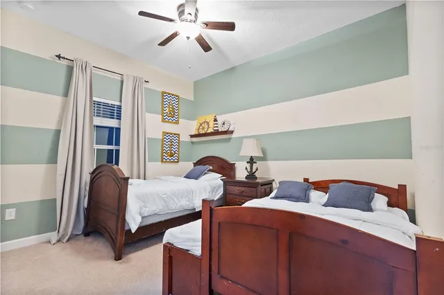 a bedroom with furniture and a window