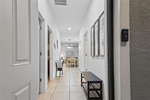 a view of hallway with furniture and a painting