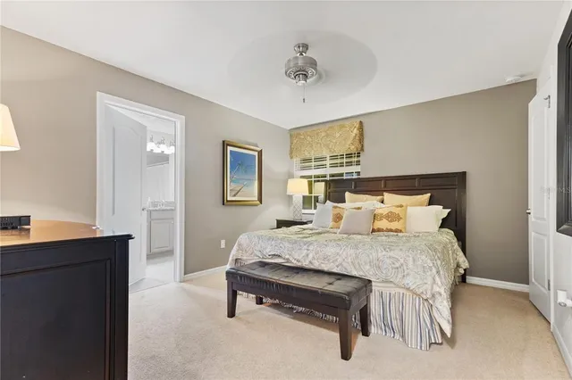 a bedroom with a bed and a table in it