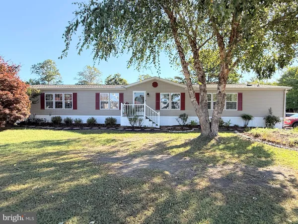 a front view of house with swimming pool and porch