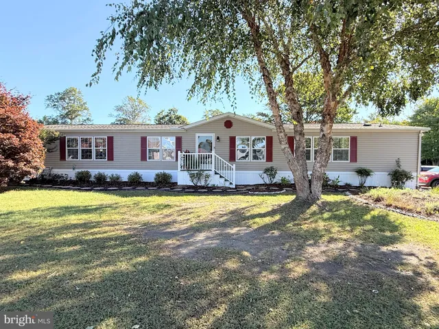 a front view of house with swimming pool and porch