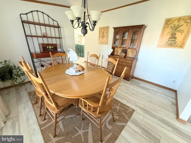 a view of a dining room with furniture and window