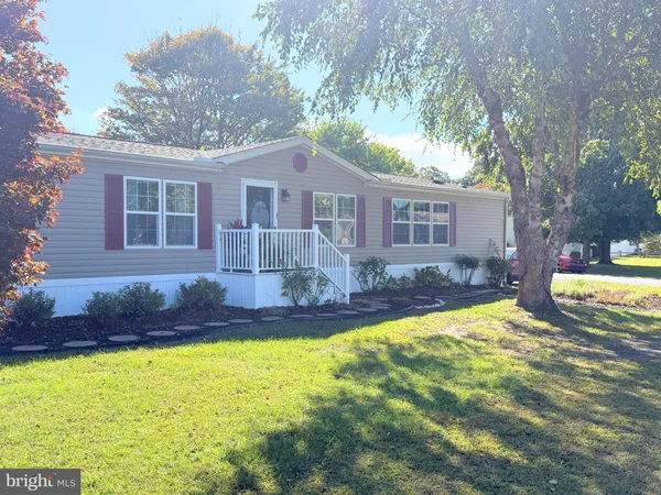 a view of a house with swimming pool and porch