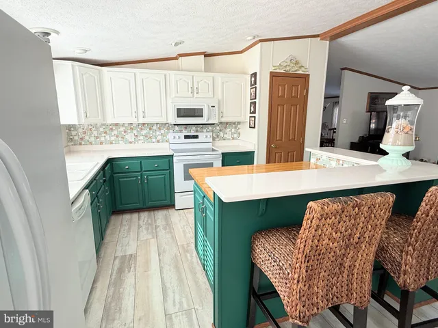 a view of a balcony with wooden floor