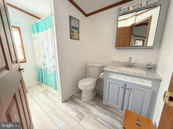 a bedroom with a bed couch and window