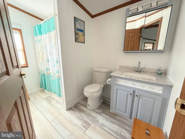 a bedroom with a bed couch and window