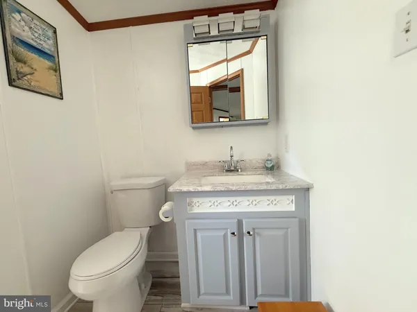 a bed sitting in a room next to a lamp