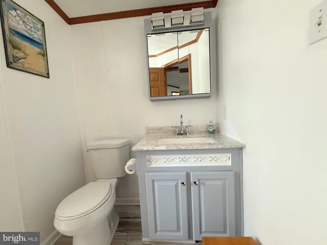 a bed sitting in a room next to a lamp