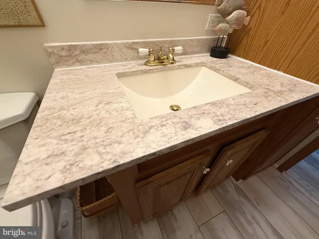 a view of wooden deck with a patio