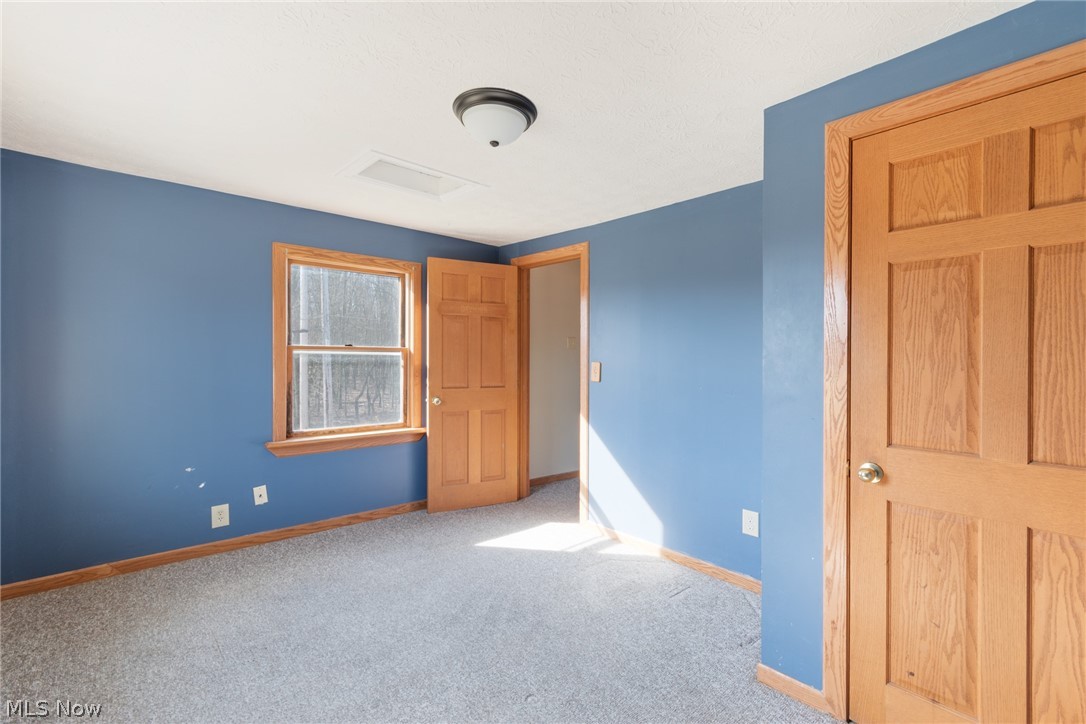 16333 Courtney Road Alliance, OH 44601 - Photo 28 of 31 Unfurnished bedroom with light colored carpet