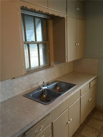 a kitchen with a stove and a refrigerator