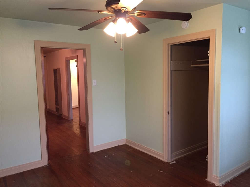 611 West 37th Street, Unit B Austin, TX 78705 - Photo 7 of 9 an empty room that has a window and wooden floor