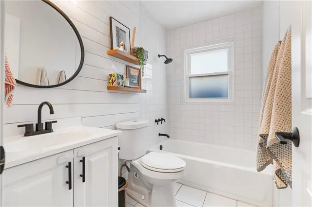 a bathroom with a sink a mirror and a bathtub