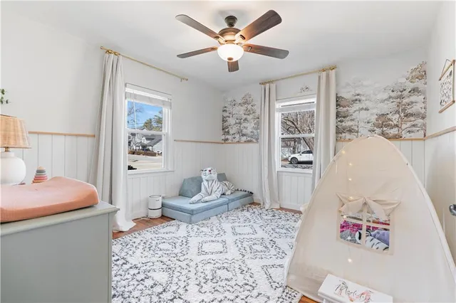 a living room with furniture and a rug