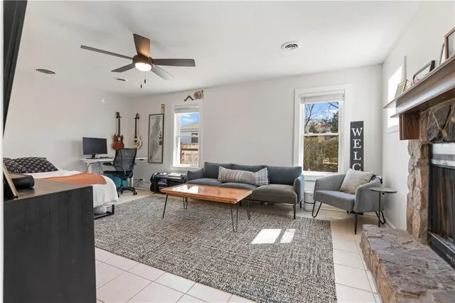 a living room with furniture and a large window