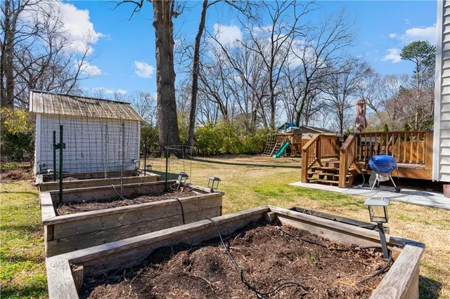 a view of a backyard with a large tree
