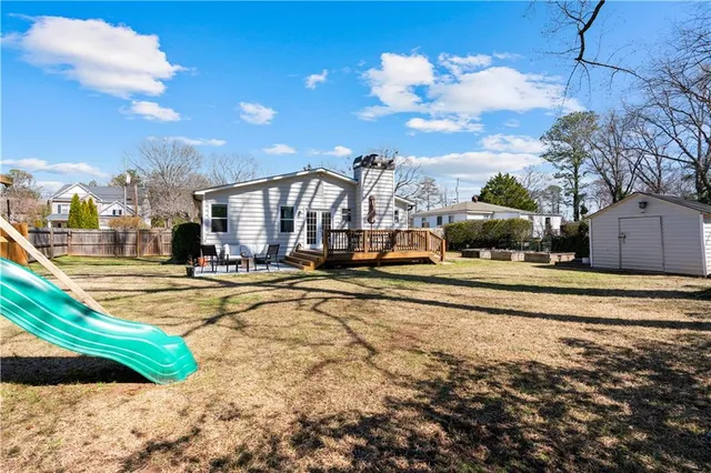 a view of a swimming pool with an outdoor seating