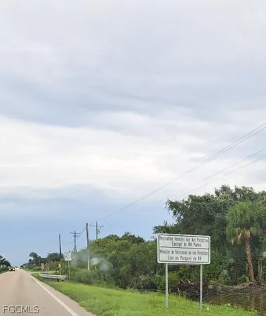a view of a lake with couches chairs