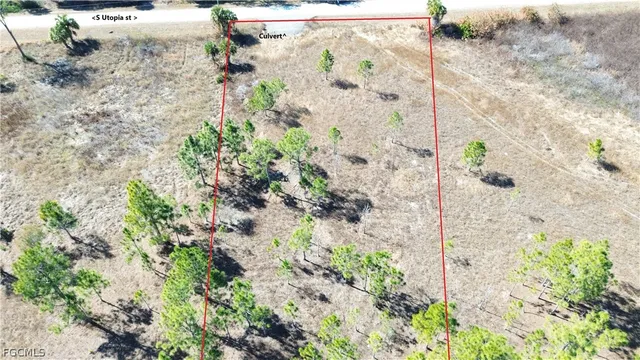a view of mirror with bathtub in background