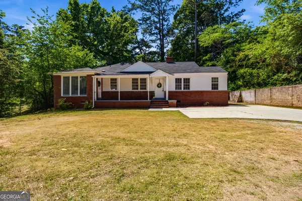 a house with trees in the background