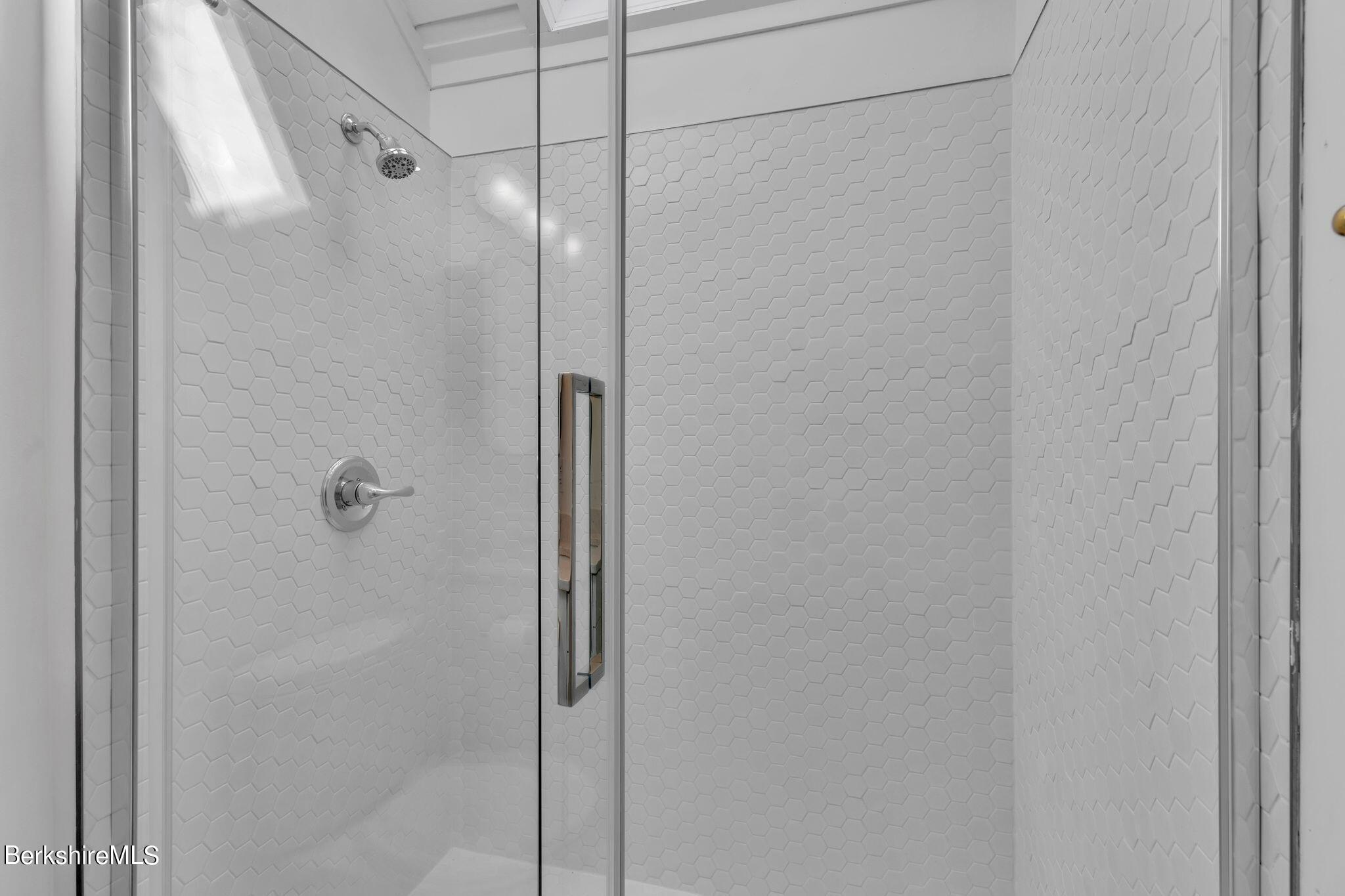 21 Sandisfield Road Sandisfield, MA 01255 - Photo 29 of 65 a bathroom with a glass shower door