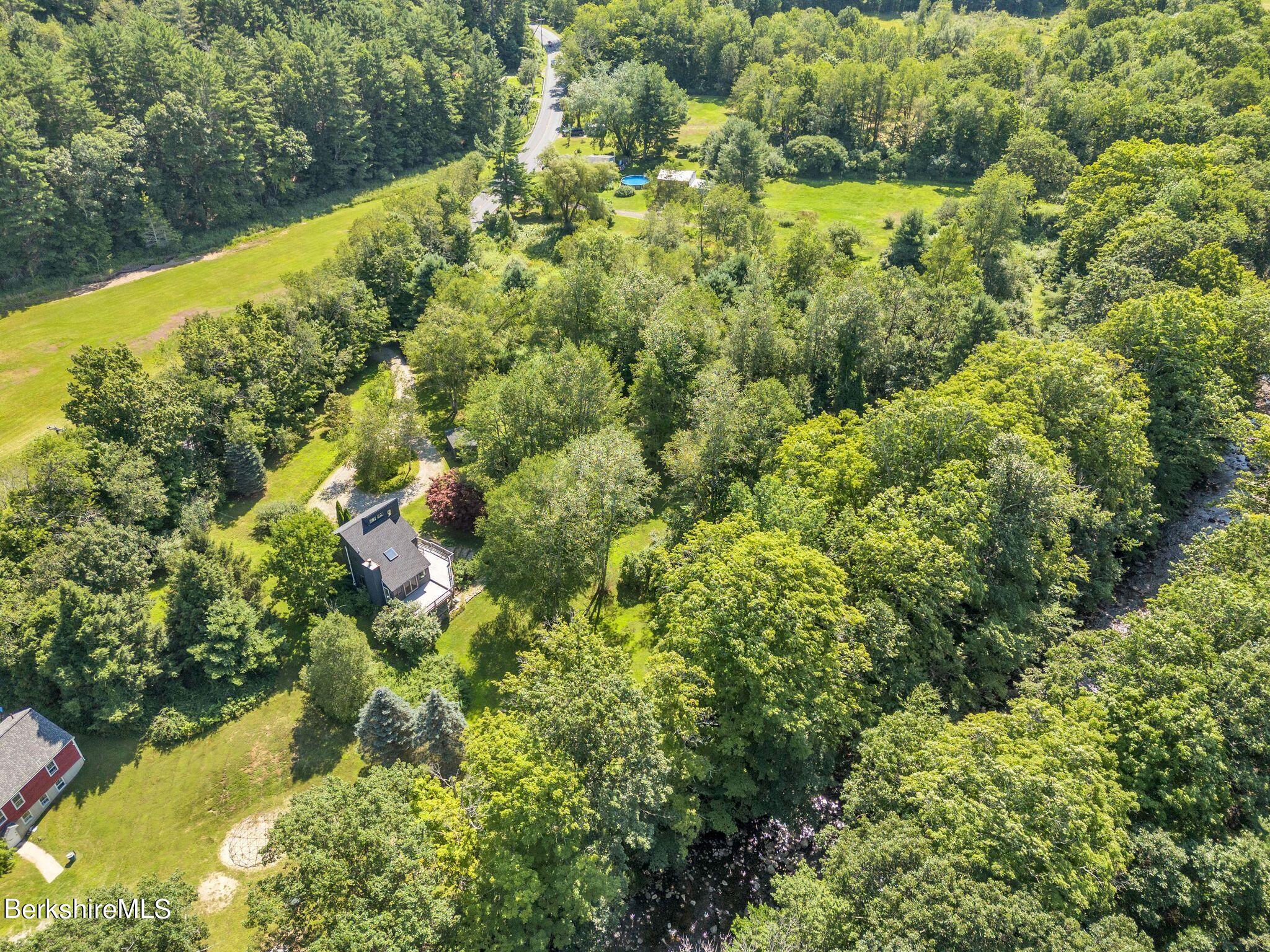 21 Sandisfield Road Sandisfield, MA 01255 - Photo 53 of 65 a view of a forest with a houses