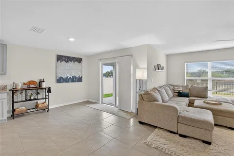 a bedroom with a large bed and a large window