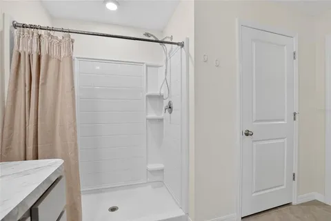 a view of a hallway with furniture and closet
