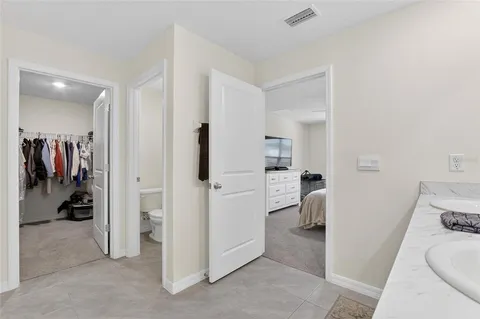 a bedroom with furniture and window