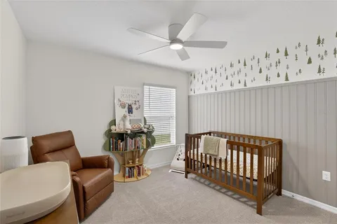 a bedroom with furniture and a window