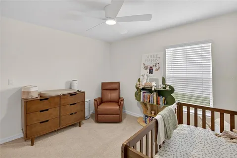 a bedroom with furniture and wooden floor