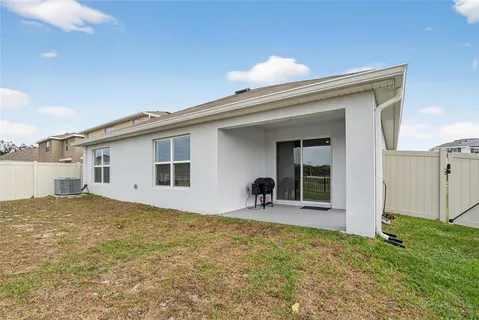 a backyard of a house with lots of green space