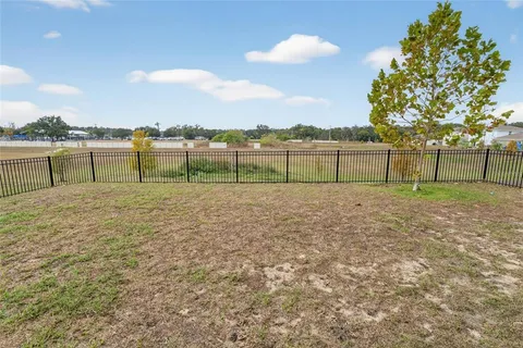 a view of a lake with a big yard