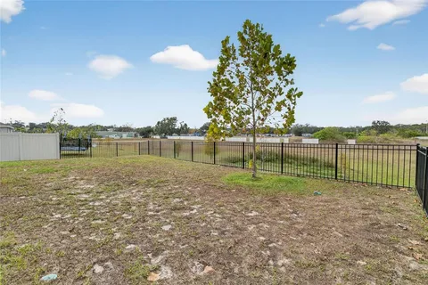a roof deck with table and chairs