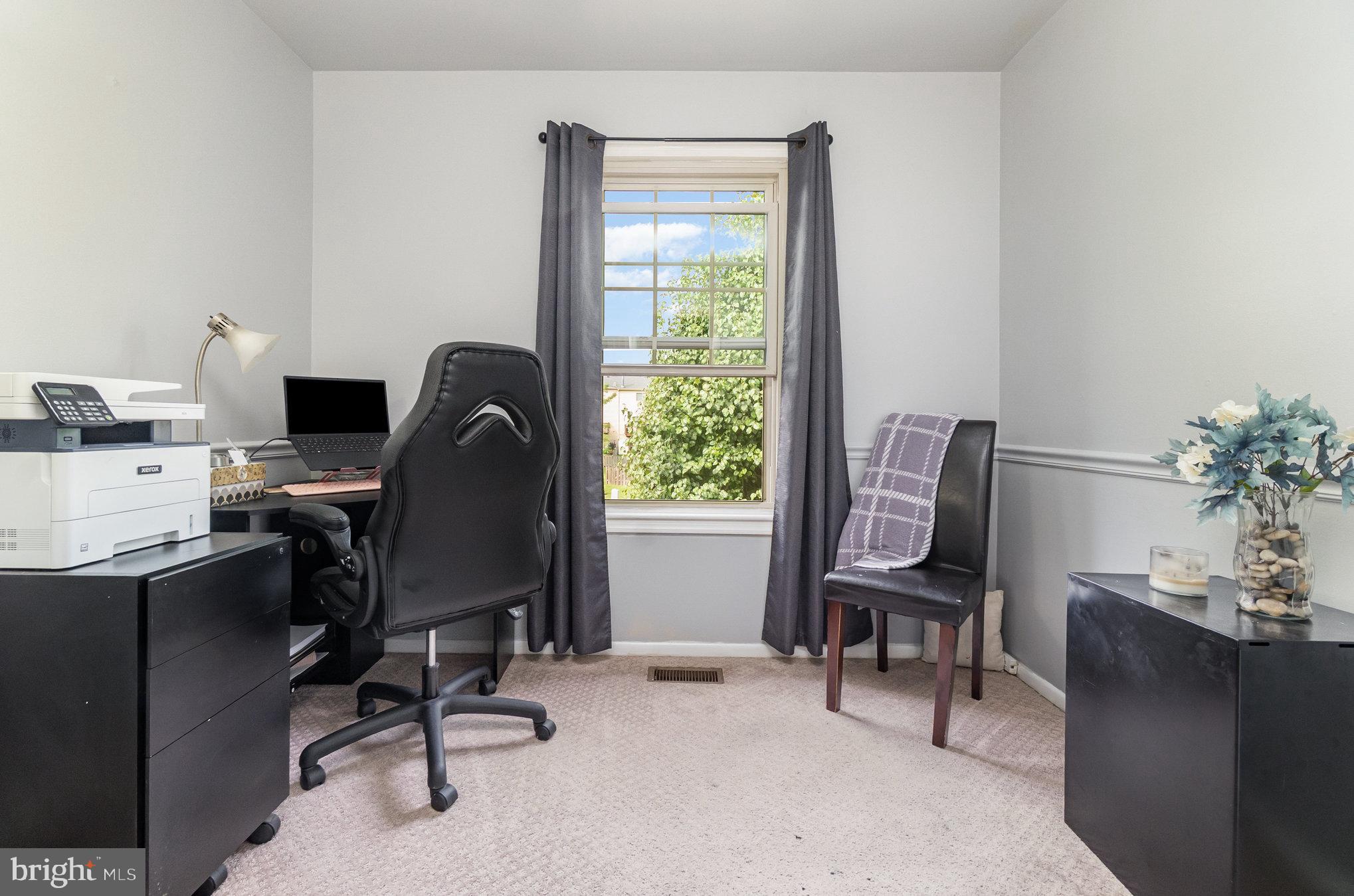 22 Bryce Court Baltimore, MD 21236 - Photo 17 of 28 a view of a workspace with furniture and a window