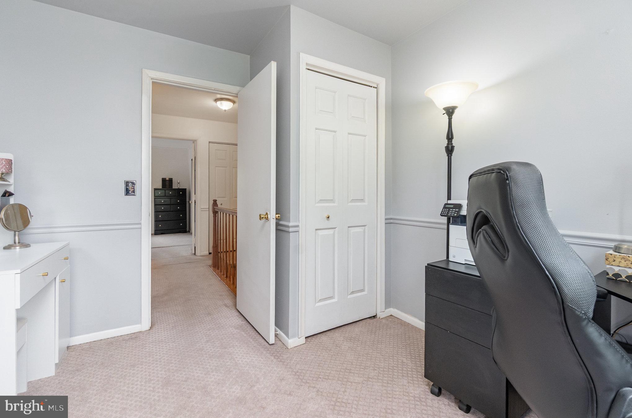 22 Bryce Court Baltimore, MD 21236 - Photo 18 of 28 a view of a hallway with workspace to rooms and stairs