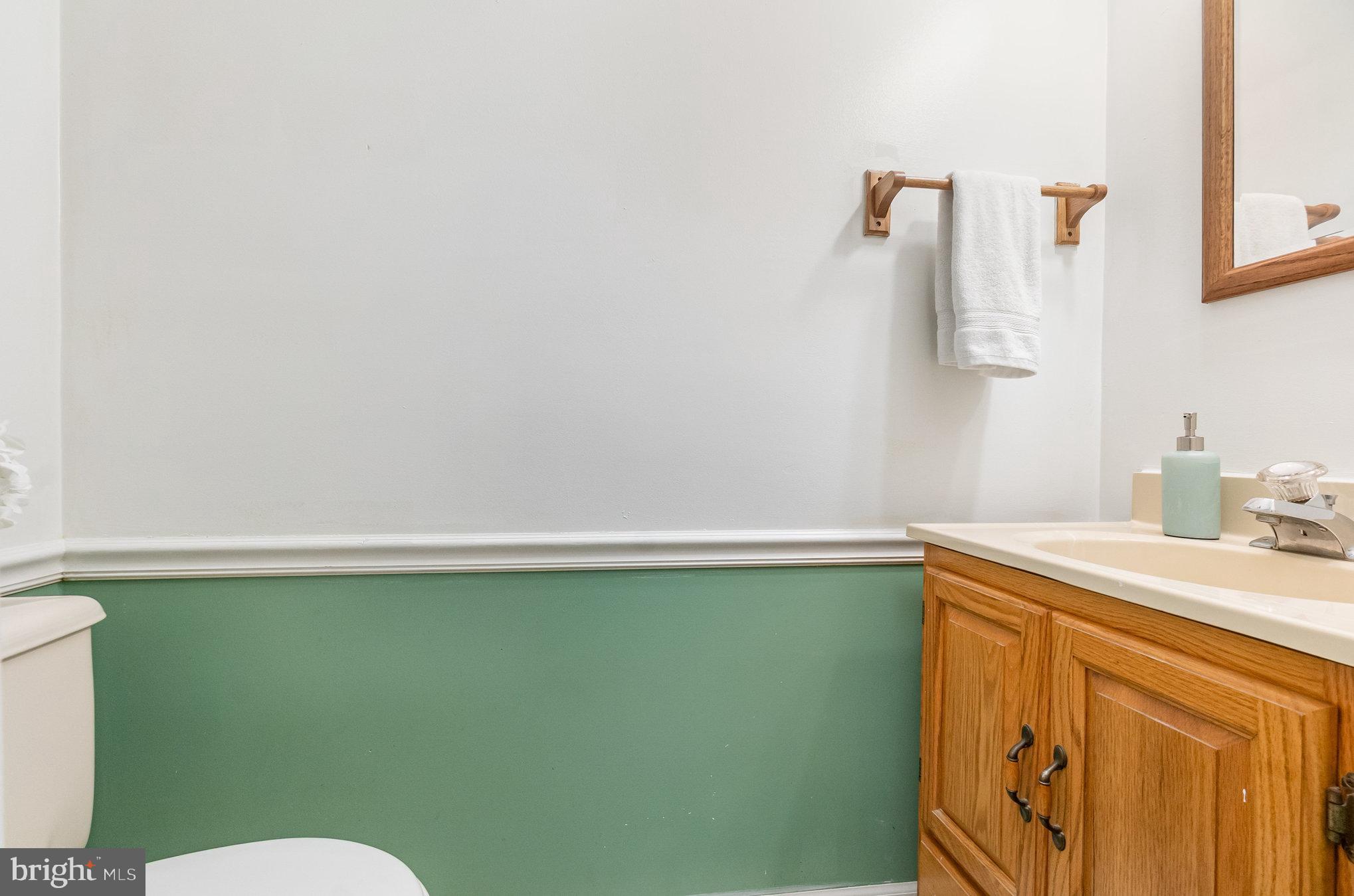 22 Bryce Court Baltimore, MD 21236 - Photo 20 of 28 a bathroom with a sink a toilet and vanity