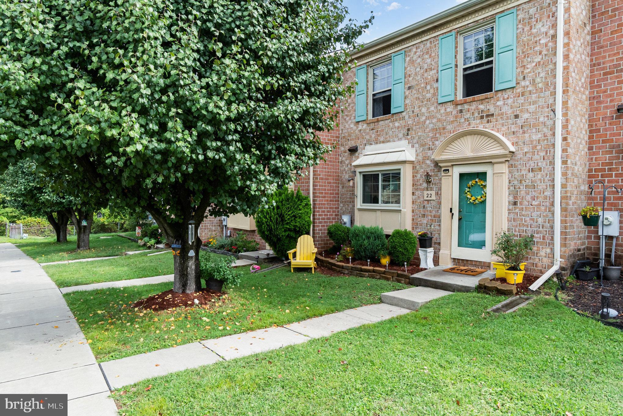 22 Bryce Court Baltimore, MD 21236 - Photo 2 of 28 a front view of a house with garden and trees