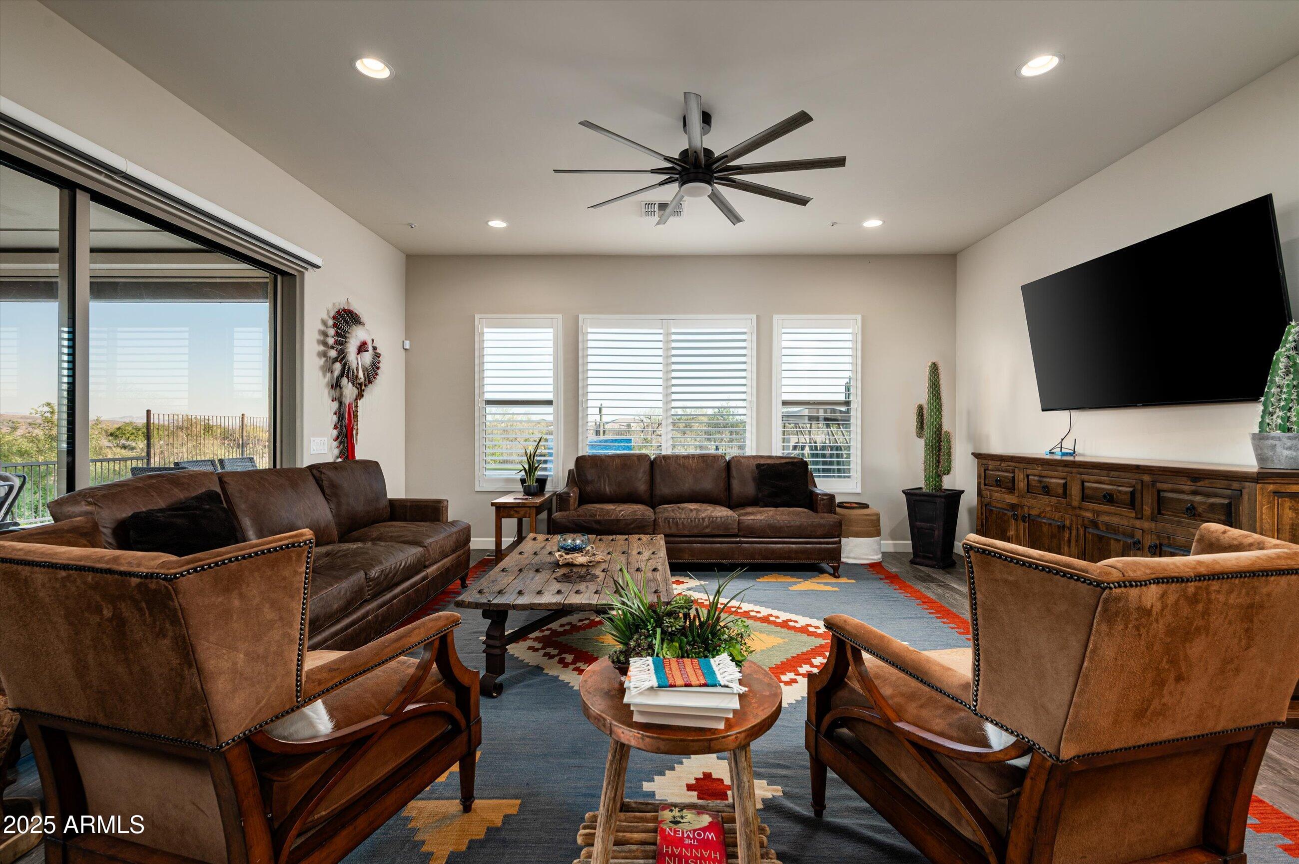 17971 East Cindercone Road Rio Verde, AZ 85263 - Photo 11 of 58 a living room with furniture and a flat screen tv