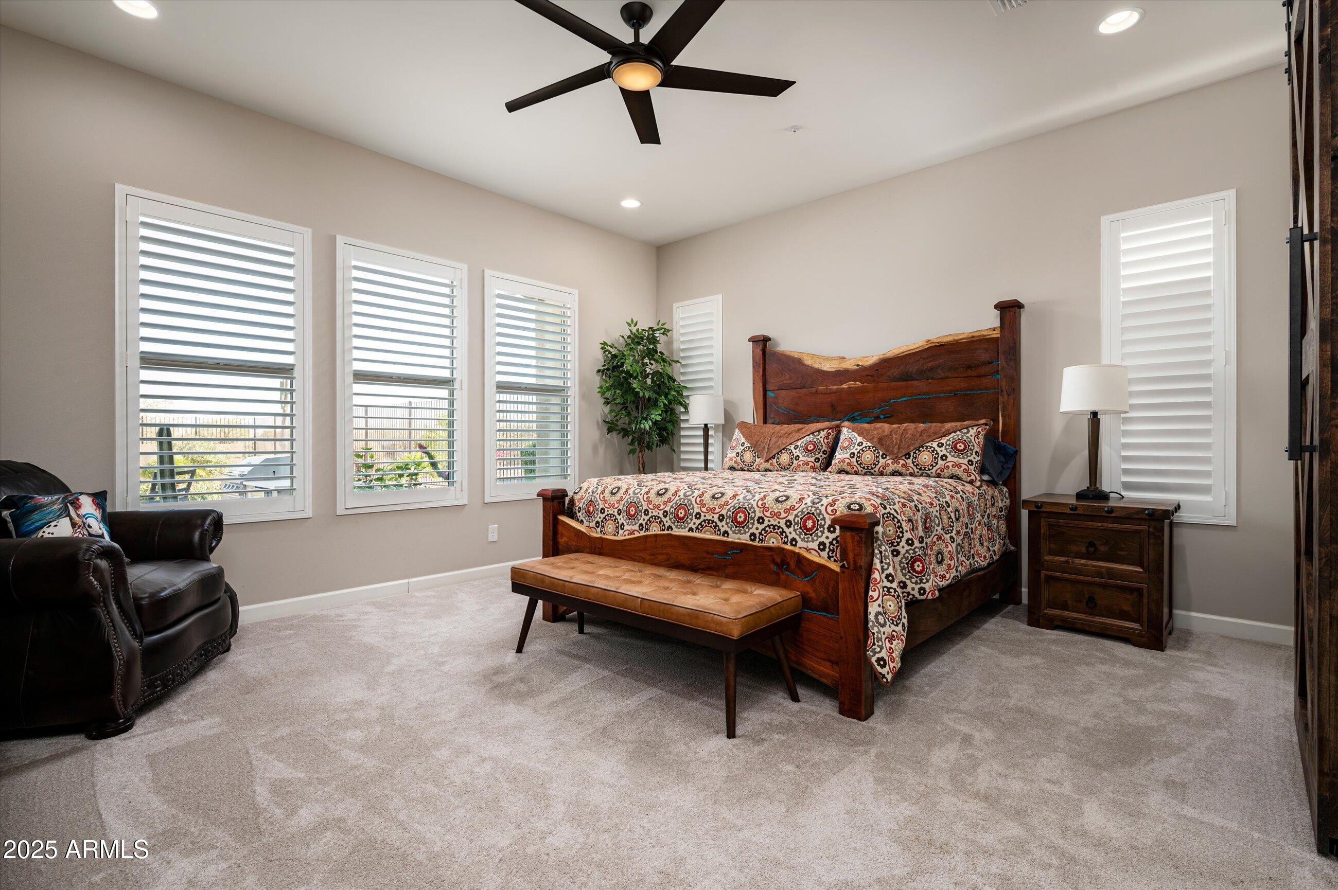 17971 East Cindercone Road Rio Verde, AZ 85263 - Photo 16 of 58 a bedroom with a bed and a couch