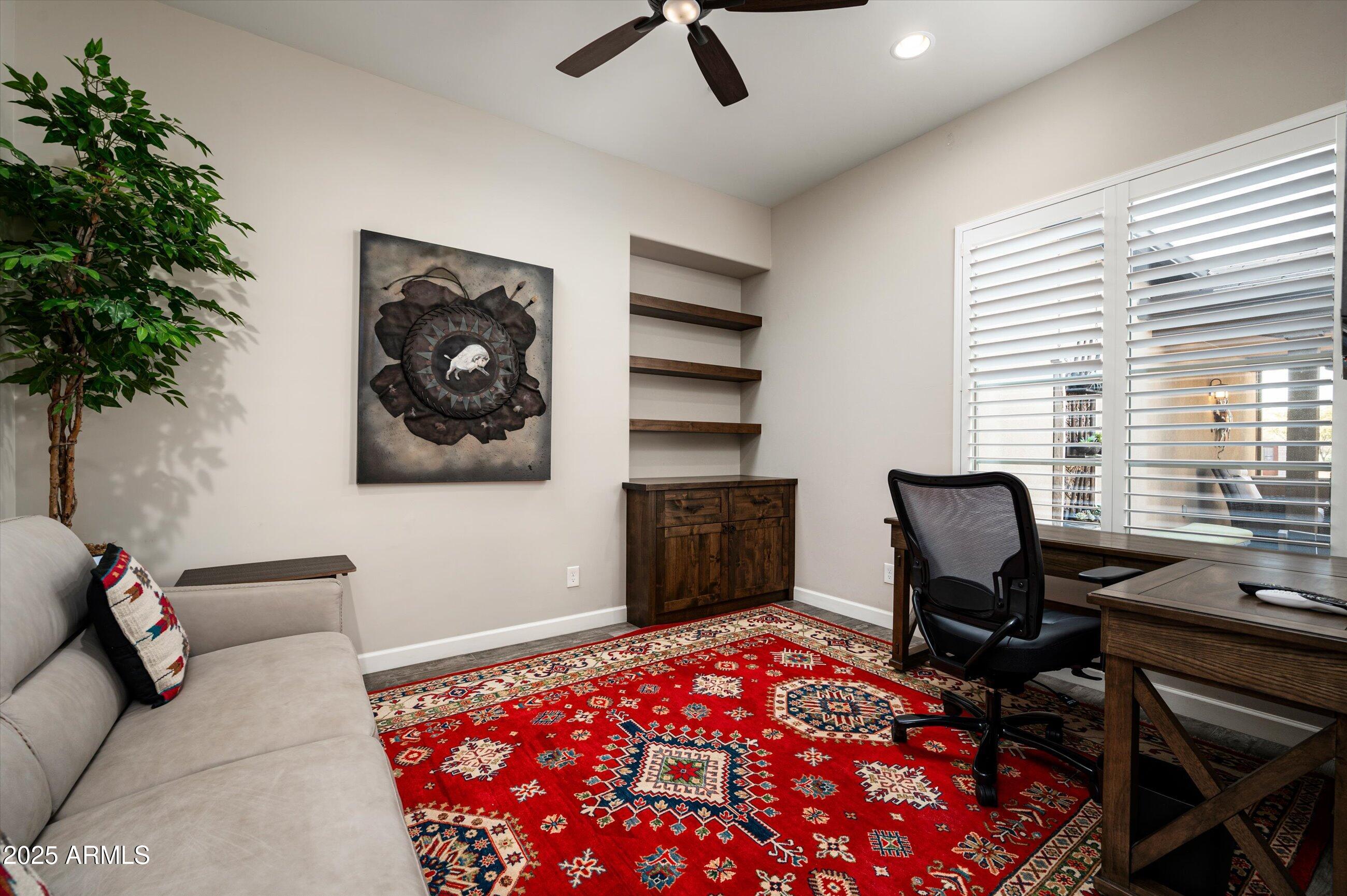 17971 East Cindercone Road Rio Verde, AZ 85263 - Photo 23 of 58 a view of a workspace with furniture and a window