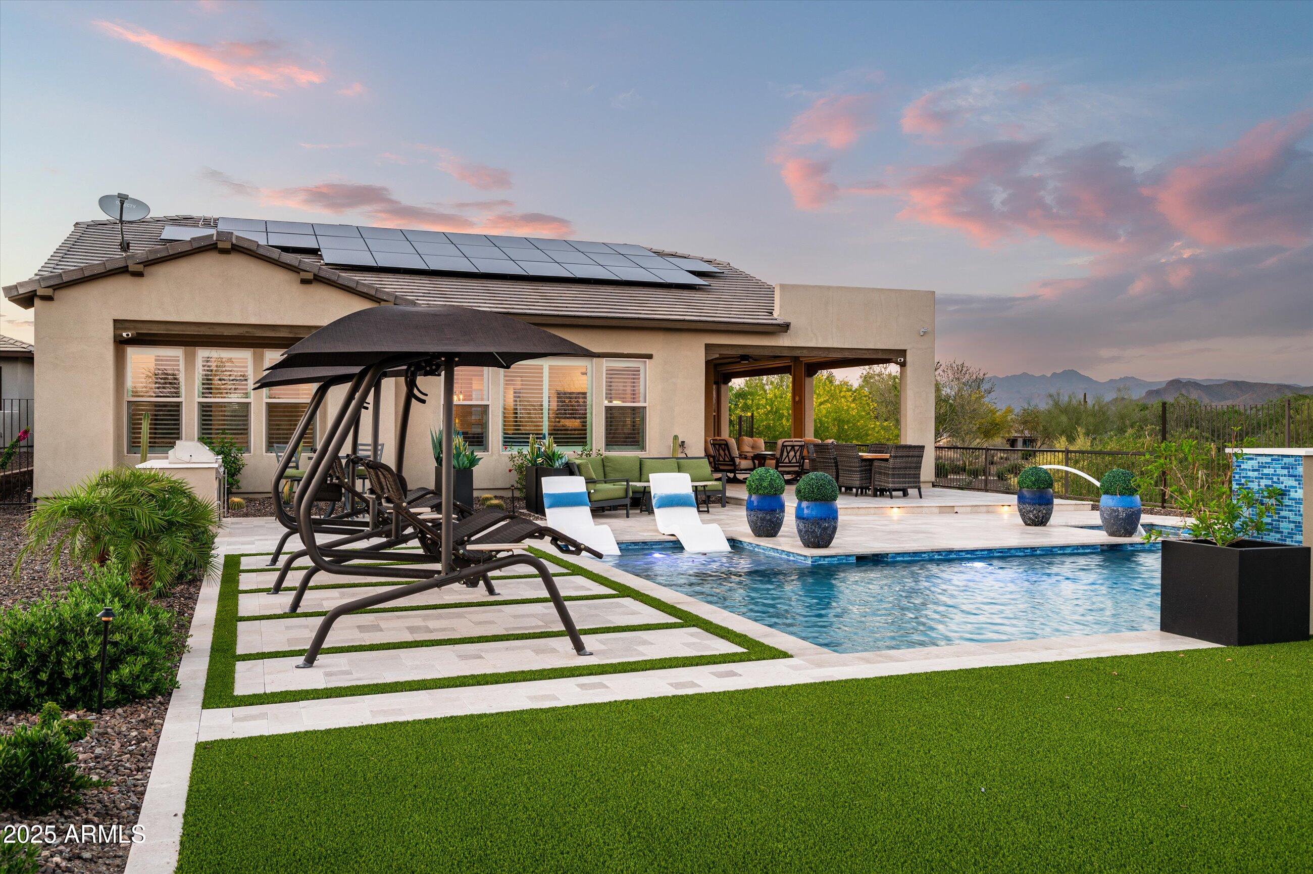 17971 East Cindercone Road Rio Verde, AZ 85263 - Photo 33 of 58 a view of a swimming pool with a patio