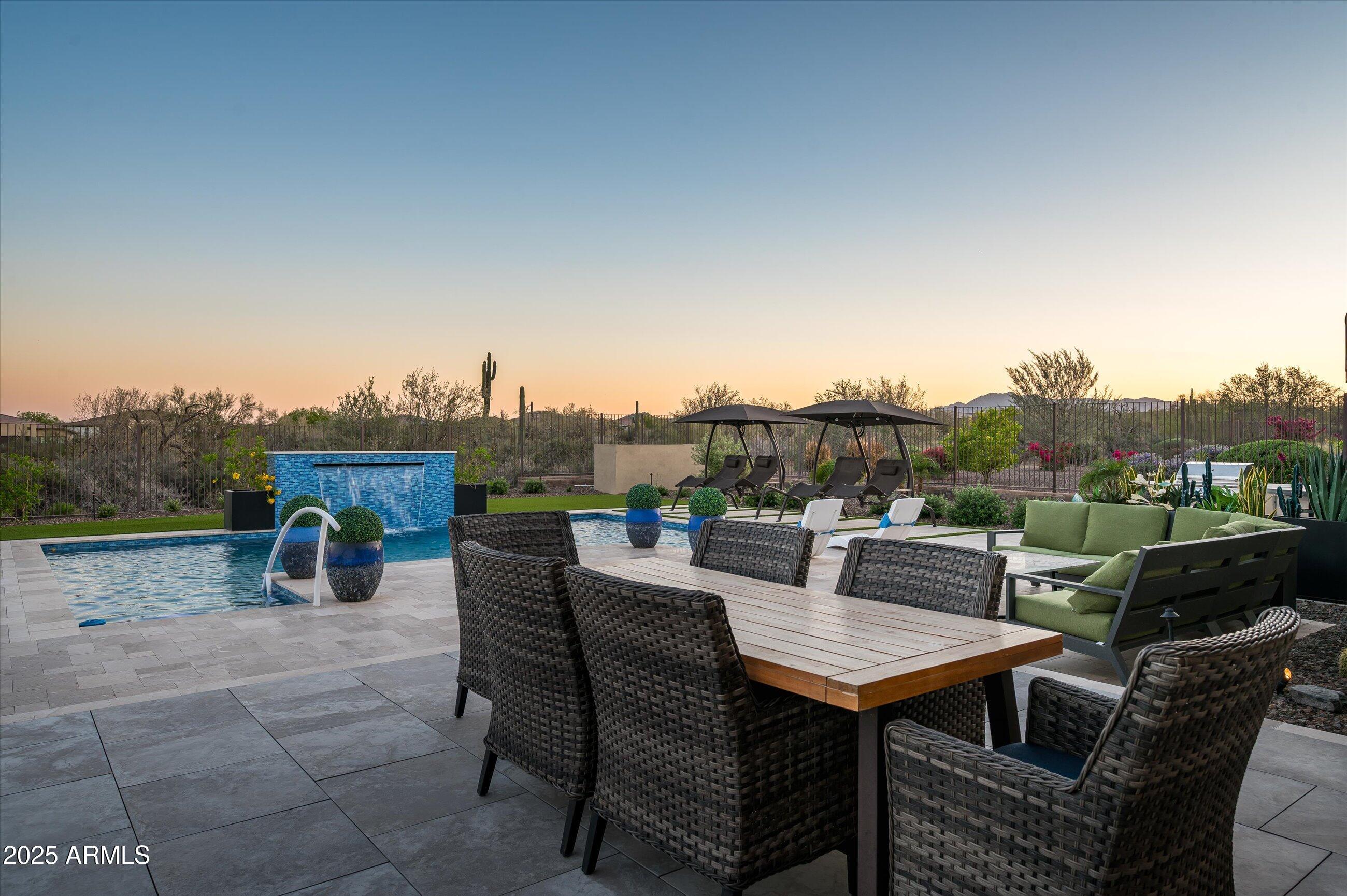 17971 East Cindercone Road Rio Verde, AZ 85263 - Photo 35 of 58 a view of a terrace with furniture and a table