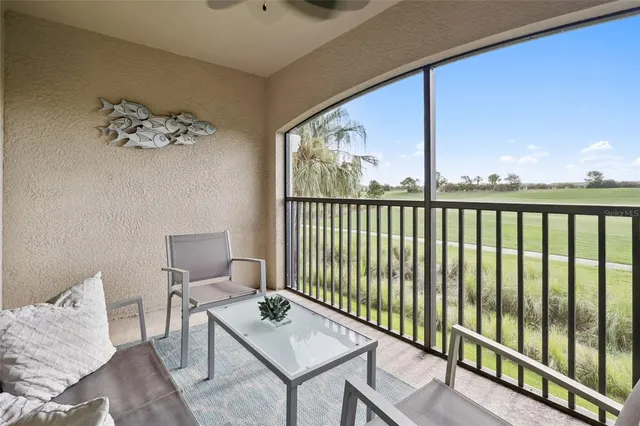 a view of a balcony with furniture